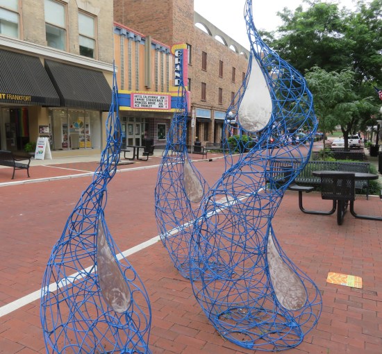 Sculpture of blue curving wire spires.