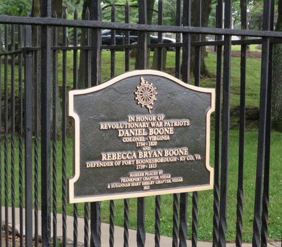 Sign on the fence around the Boones' graves with names and dates, and mentions Rebecca was a "defender of Fort Boonesborough".