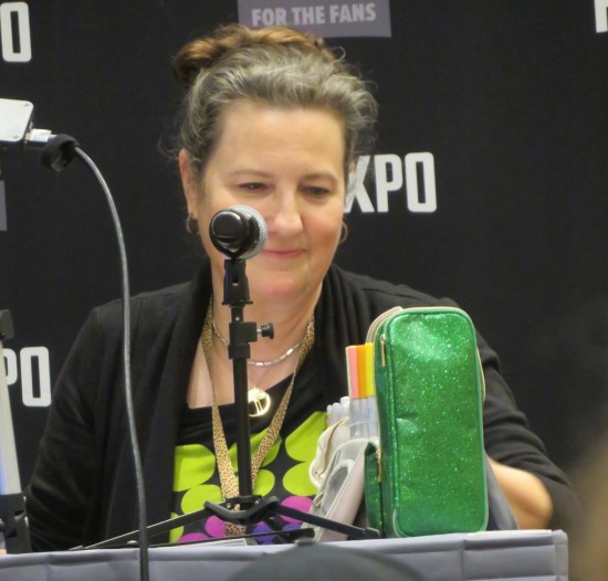 Amanda Conner at a panel table, getting her tools ready.