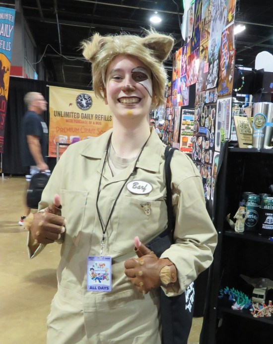 female Barf cosplayer giving thumbs-up.