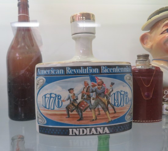 American Revolution Bicentennial flask made in Indiana, with traditional three-man patriotic band on the front.