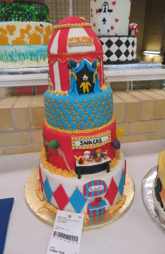 4-layer cake with circus decorations.