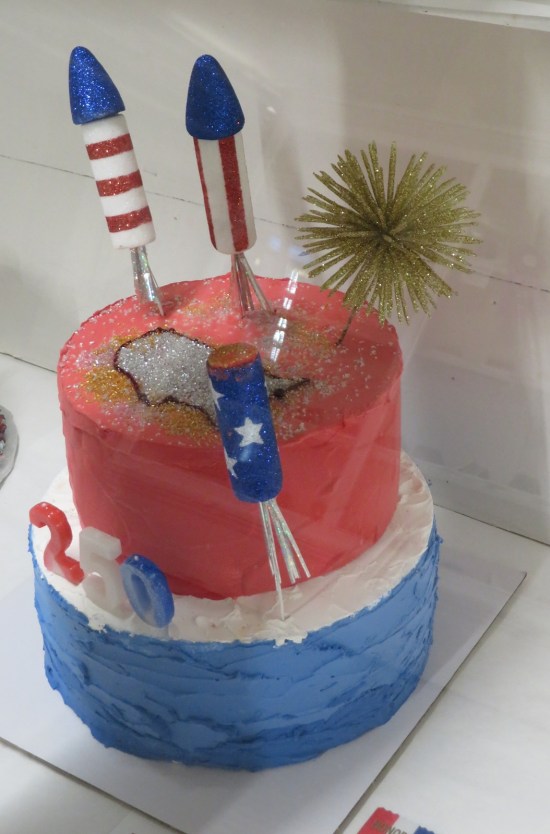 cake topped with fake baked fireworks.