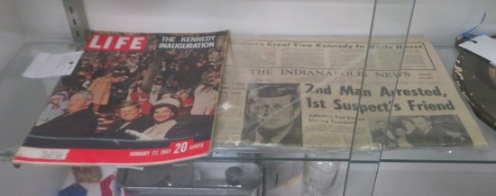 A January 1961 Life magazine cover story about JFK's inauguration, and an issue of Indianapolis News with a headline about him.