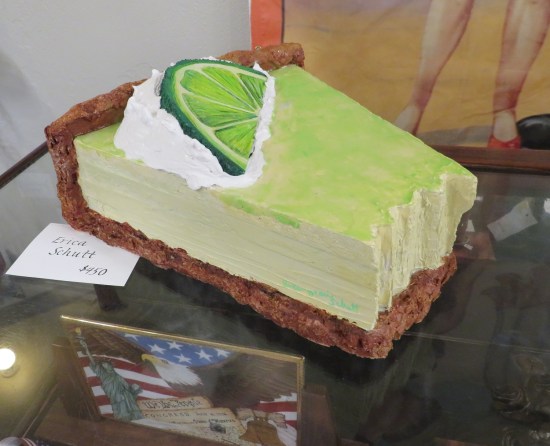 key lime pie sculpture with big fake lime on top.