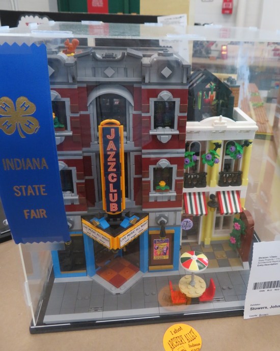three-story Lego brownstone with vertical marquee reading "jazz club".