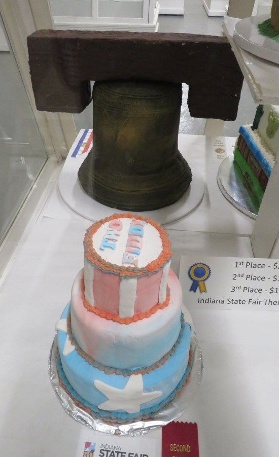 Cake shaped like the Liberty Bell and a cake that says "Two Fiddy" on top.