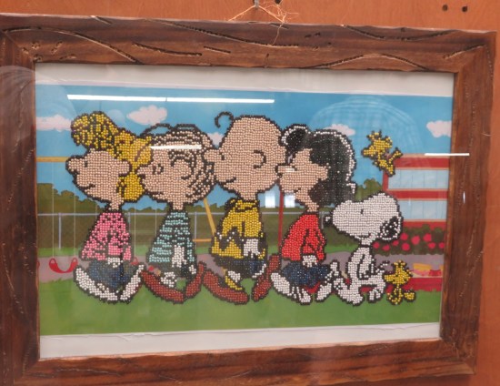 Sally, Linus, Charlie Brown, Lucy, and Snoopy art in beads.