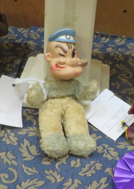 old teddy bear with Popeye's head for some reason
