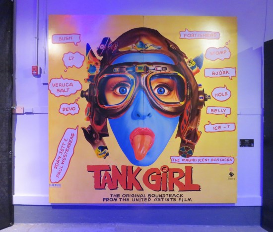 Painted replica of the Tank Girl soundtrack cover with Lori Petty's face and lots of random band names.