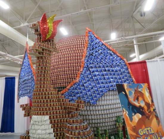 Canned Charizard taller than me, with canned wings spread wide
