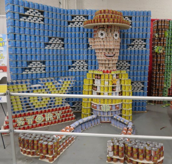 Canned Sheriff Woody lying disheveled on bedroom floor.