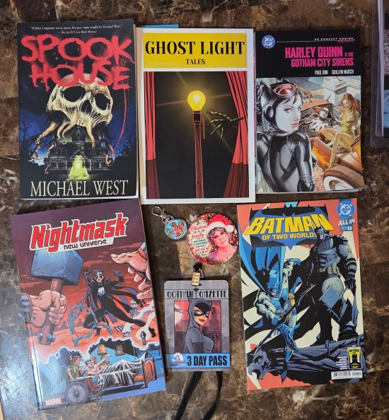 Various books we acquired at the show, plus a couple accessories.