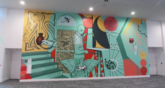 Indoor mural about art and random stuff, mostly aquamarine.