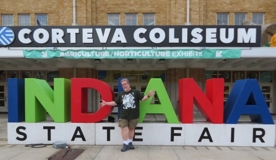 Me doing jazz hands in front of the Indiana State Fair sign in front of the Coliseum.
