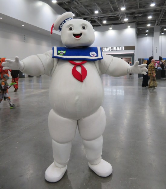 Mr. Stay-Puft cosplayer, arms open wide and all smiles and pristine white.