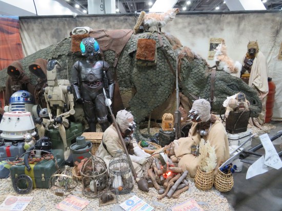 Life-size Ronto model behind the Tusken Raider family, plus a couple other Star Wars mannequins.