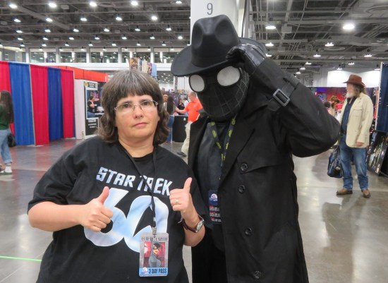 Anne posing with and pointing at a Spider-Man Noir cosplayer.