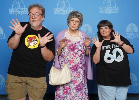 Us doing jazz hands with Vicki Lawrence, who's in costume as Thelma Harper from "Mama's Family", holding her purse.