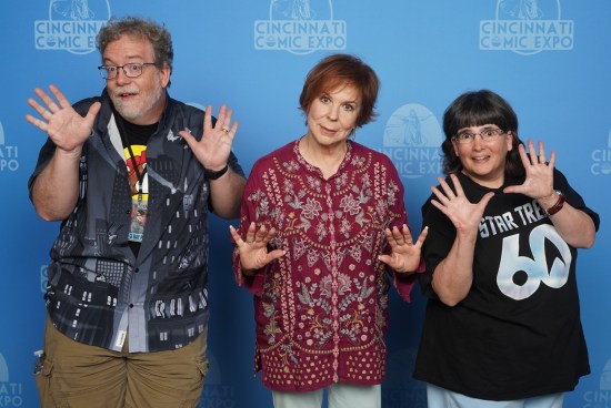 Us doing jazz hands with Vicki Lawrence in a purple top.