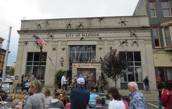 Country band plays in front of City Hall, decorated for Halloween.
