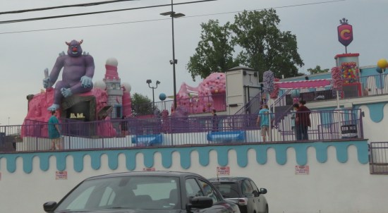 Miniature golf course decorated entirely in pinks and light purples.