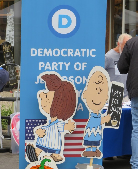 Democratic Party of Jefferson County decorates their booth with pics of Charlie Brown and Peppermint Patty wearing blue.