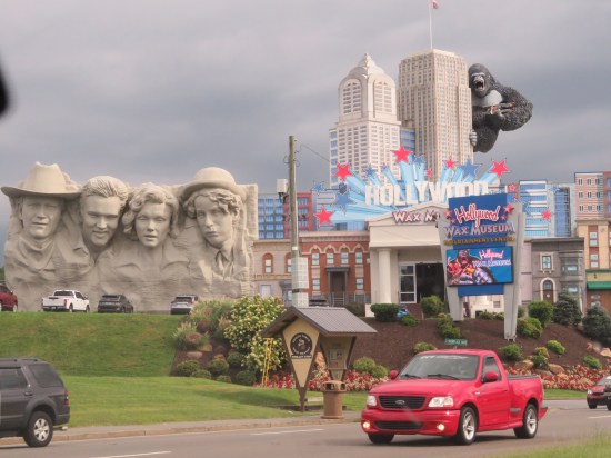 The Hollywood Wax Museum with giant sign, replica skyscrapers with giant King Kong on one side. Next door is a Mount Rushmore pastiche with the heads of Elvis, Michelle Pfeiffer, Charlie Chaplin, and possibly Michael Rooker as a cowboy, but probably not.