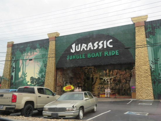 Jurassic Jungle Boat Ride us a giant green building with dinosaur and jungle decor.