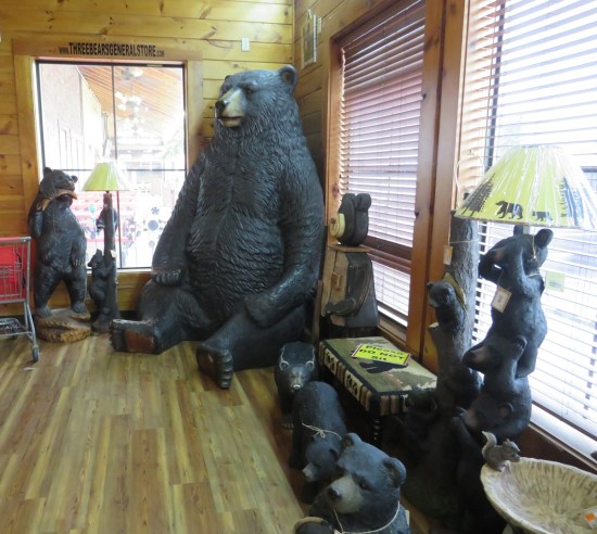Store foyer full of chairs and over a dozen bear statues and art pieces.
