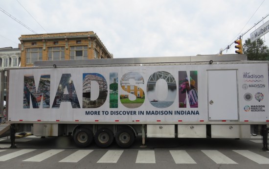 white semi trailer blocking an intersection with a large MADISON logo across the side.