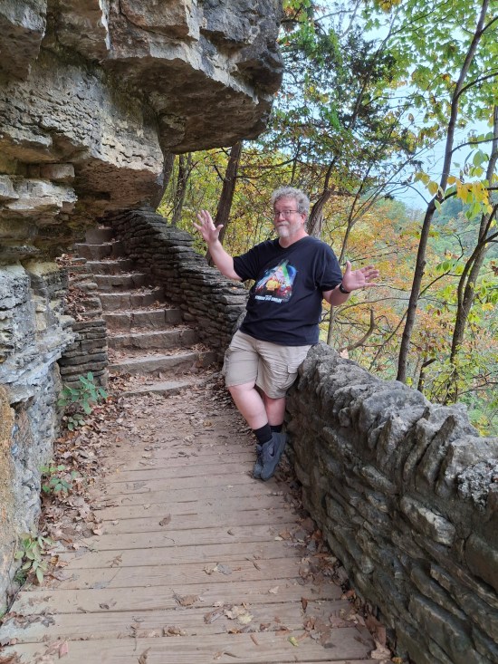 me doing jazz hands on park trail stairs.