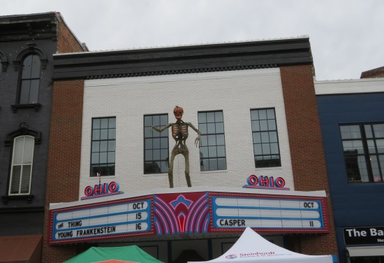 Ohio Theatre marquee with pumpkin-headed skeleton on it. Movies coming soon include Casper, The Thing, and Young Frankenstein.