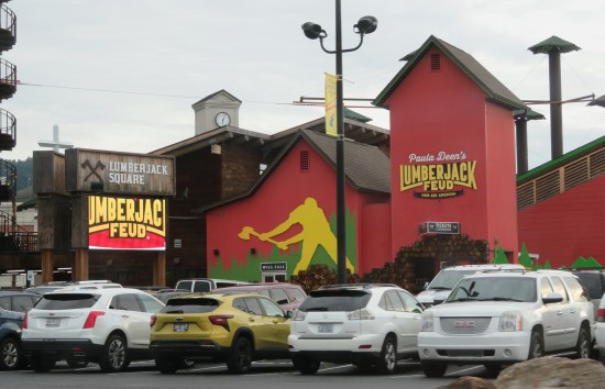 Paula Deen's Lumberjack Feud theater, red building with large yellow lumberjack silhouette.