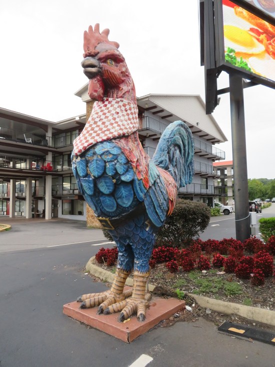 rooster statue outside a restaurant.