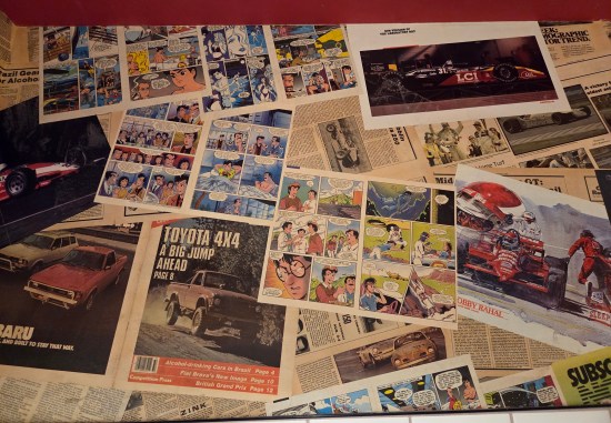Walls covered in racing magazines and Speed Racer comics